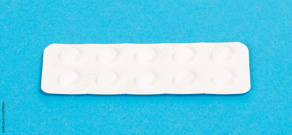 Pill strip on blue on background