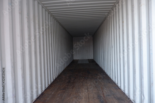 Inside empty dry high cube container with wooden floor