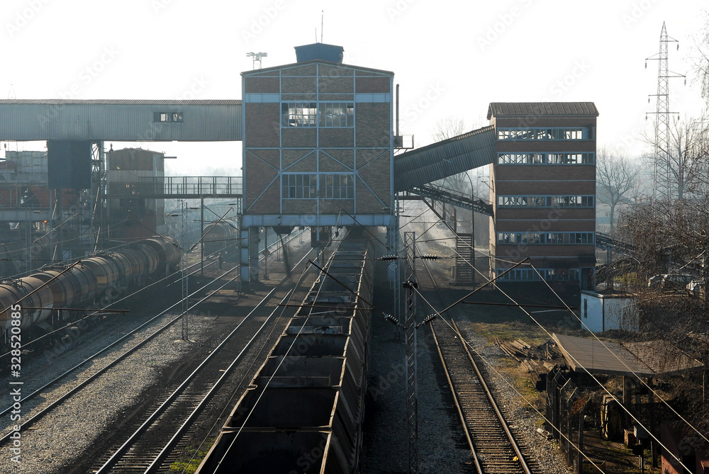 Obraz premium Freight train station. Composition of freight wagons. Rails at the train station. Loading point for the railway station.