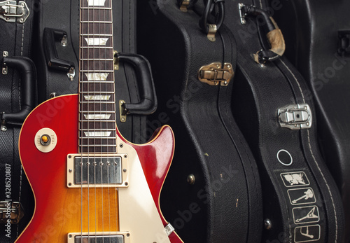 electric guitar on many guitar hard case background
