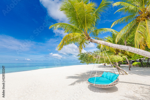 Tropical beach background as summer landscape with beach swing or hammock and white sand and calm sea for beach banner. Perfect beach scene vacation and summer holiday concept. Boost up color process