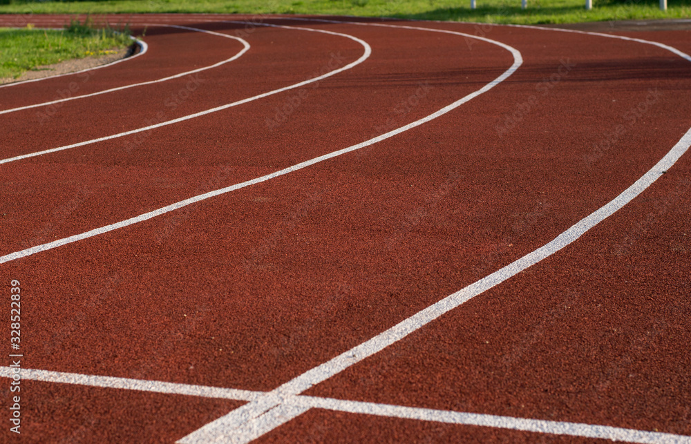 Running track in the stadium. Rubber coating. Treadmill in the fresh air. Healthy lifestyle concept. Athletes cardio workout Running track in the stadium. Rubber coating. Treadmill in the fresh air. Healthy lifestyle concept. Athletes cardio workout