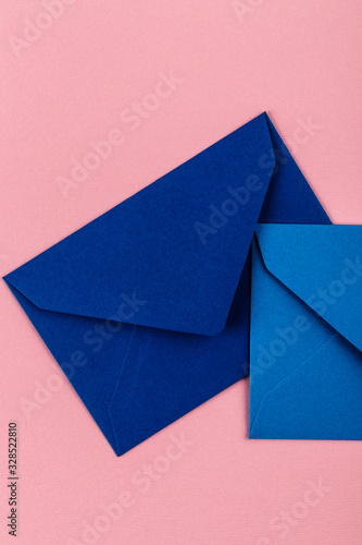 Blue envelopes on a pink background.