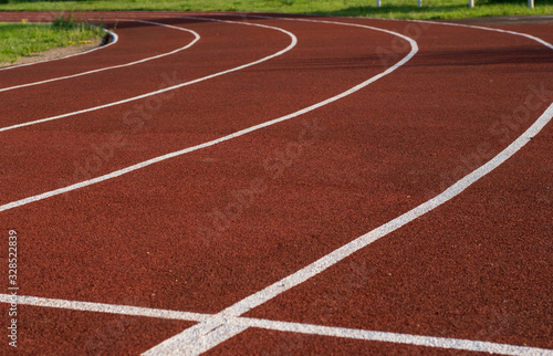 Running track in the stadium. Rubber coating. Treadmill in the fresh air. Healthy lifestyle concept. Athletes cardio workout