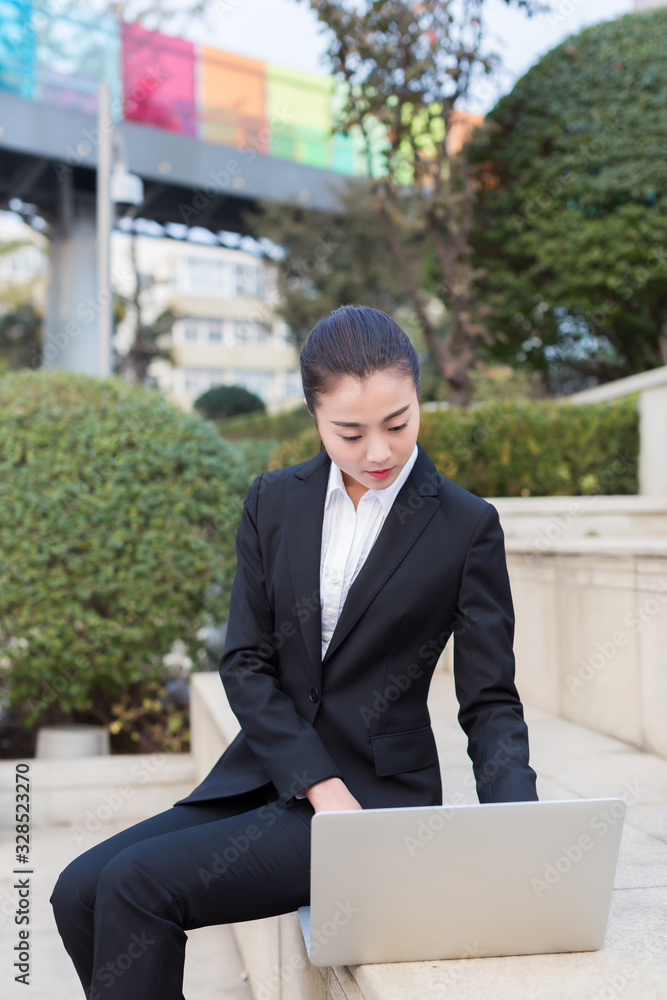 girl using a laptop computer girl using a laptop computer