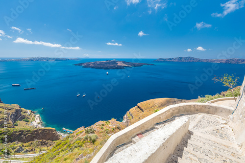 Summer travel and vacation landscape. View to the sea and Volcano from Fira the capital of Santorini island in Greece