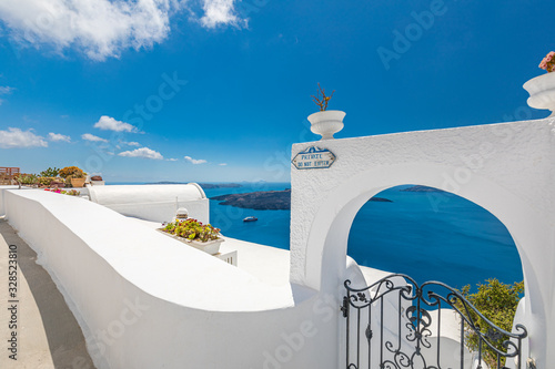 Beautiful terrace in Santorini with breathtaking view. Luxury vacation and summer travel background. Urban, street details. Amazing blue sky and white architecture