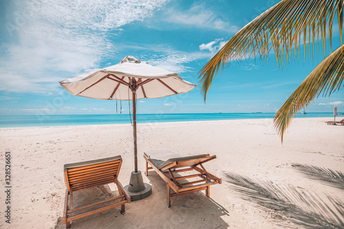 Chairs at the beach with white umbrella. Luxury beach vacation and summer travel landscape. Amazing summer mood, relaxation concept. Exotic nature, tropical pattern © icemanphotos
