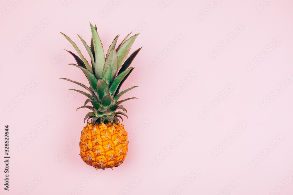 Yellow pineapple on stylish pink background. Flat lay style Yellow pineapple on stylish pink background. Flat lay style
