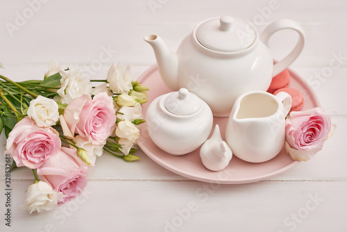 Spring card template. Happy Birthday or Valentine. Women's Day. Greeting card for mother's day. Congratulation with flowers. Flower card. Copy space. Wedding invitation.Tea set with flowers and sweet