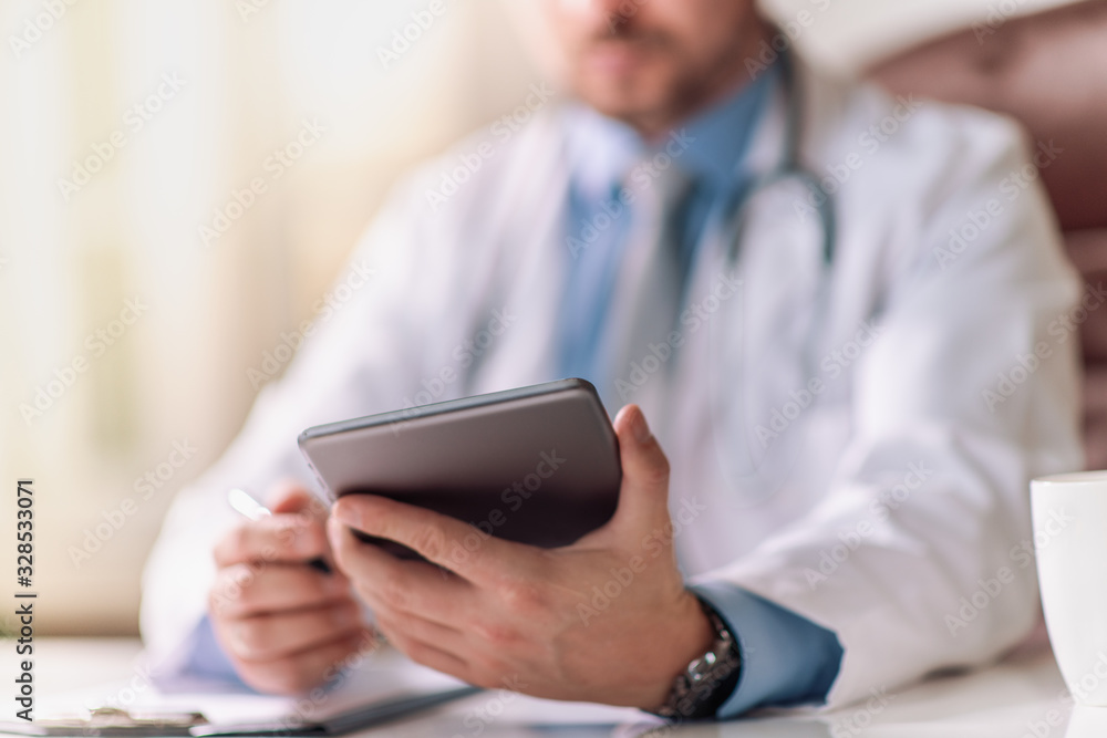 Doctor at hospital working with tablet Doctor at hospital working with tablet