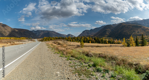 Beautiful road among autumn mountains