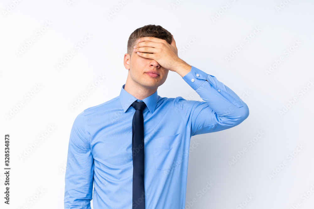 Young handsome businessman covering eyes by hands Young handsome businessman covering eyes by hands