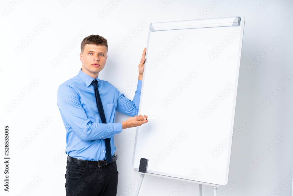 Young businessman giving a presentation on white board giving a presentation on white board Young businessman giving a presentation on white board giving a presentation on white board