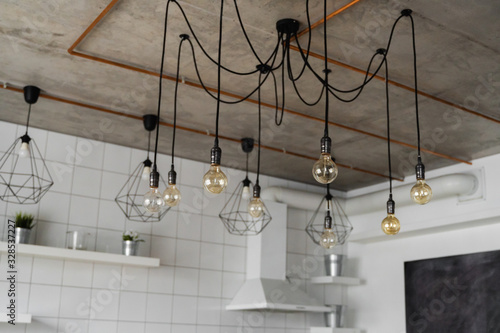 Lighting on a modern kitchen in comfortable apartment. Vintage luxury interior lighting lamp as a home decor.