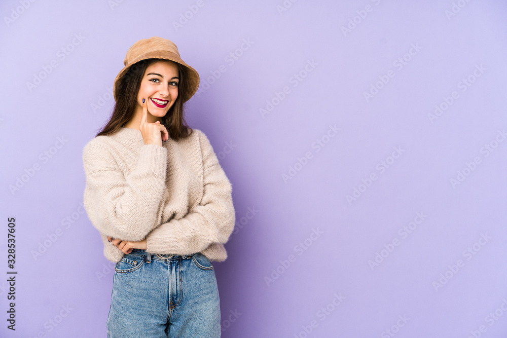 Young caucasian woman isolated on purple background smiling happy and confident, touching chin with hand. Young caucasian woman isolated on purple background smiling happy and confident, touching chin with hand.
