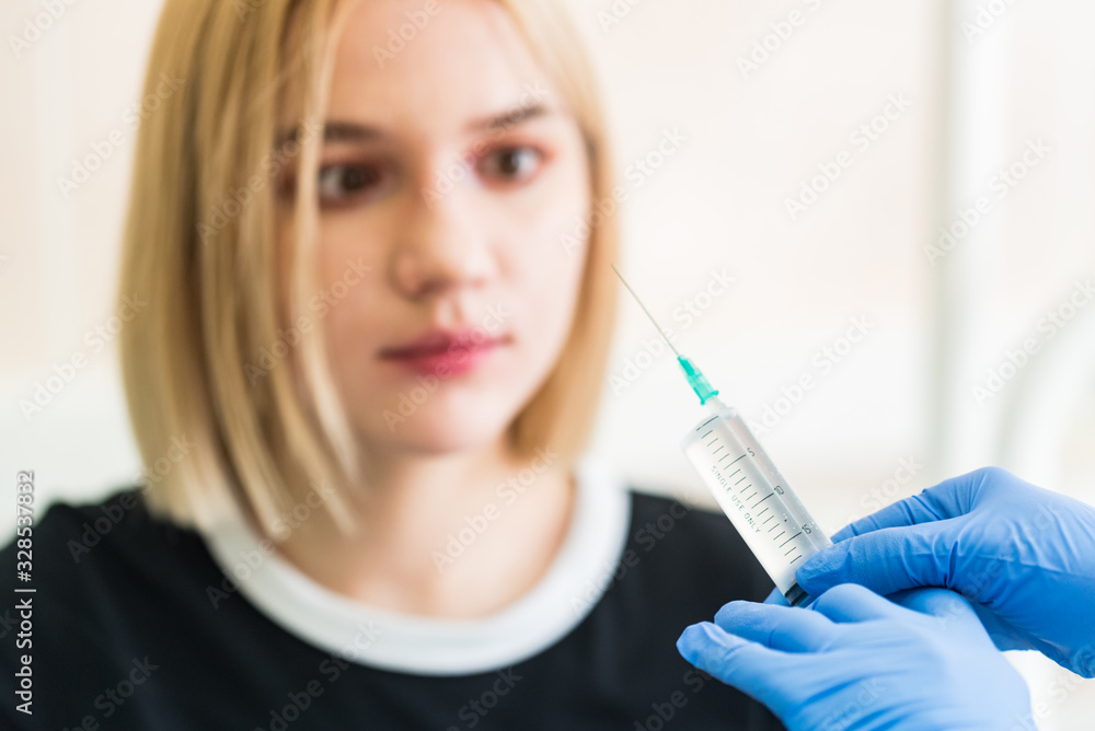 Girl shows she is afraid of injection Girl shows she is afraid of injection