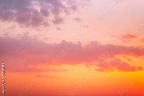 Colorful vibrant dramatic sky with purple to orange clouds. Sunset time
