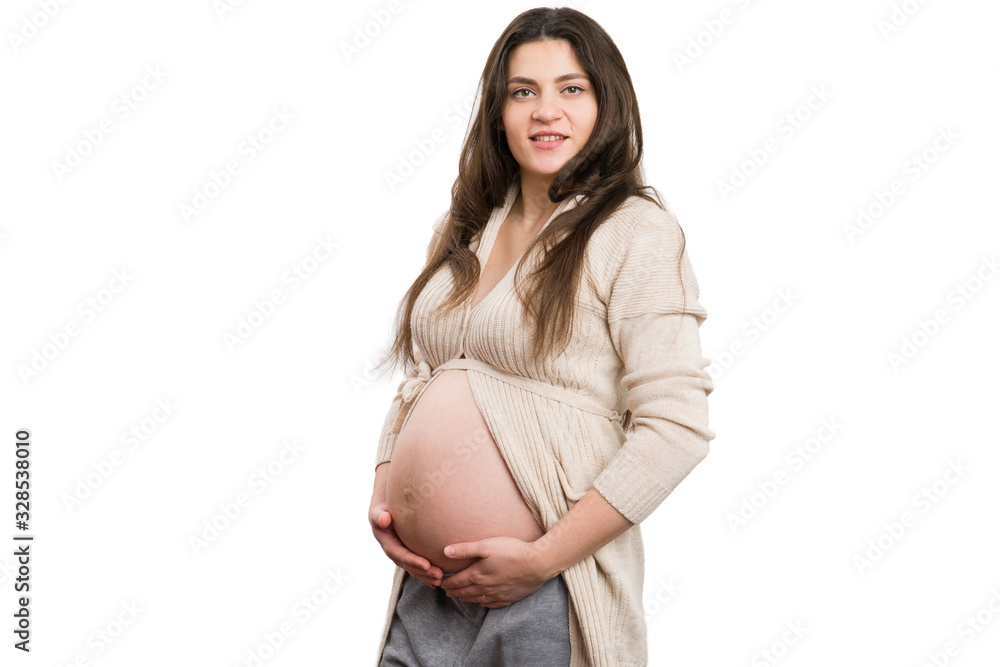 Young attractive pregnant woman holding her belly Young attractive pregnant woman holding her belly