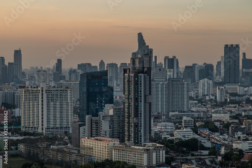 Sky view of Bangkok with skyscrapers in the business district in Bangkok in the evening beautiful twilight give the city a modern style. © num