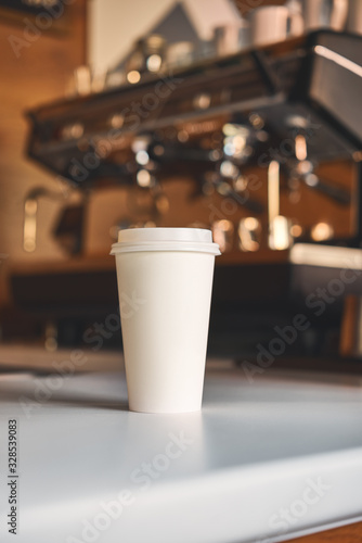 фотографія Big white clean cup of coffee to go on the white table