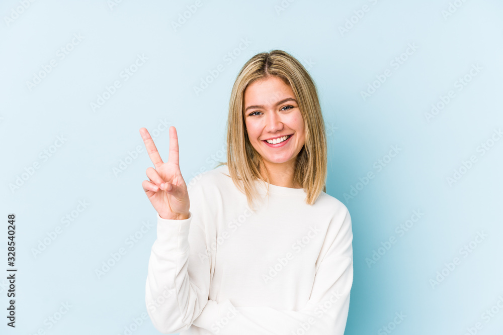 Young blonde caucasian woman isolated showing number two with fingers. Young blonde caucasian woman isolated showing number two with fingers.