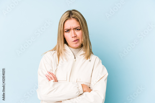 Young blonde caucasian woman isolated points down with fingers, positive feeling.
