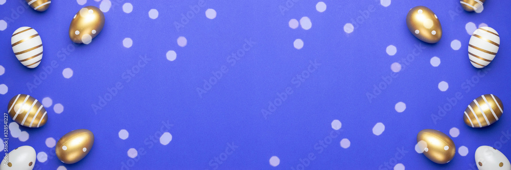 Easter basket with golden shine decorated eggs isolated on blue background. for you poster or flyer Easter basket with golden shine decorated eggs isolated on blue background. for you poster or flyer