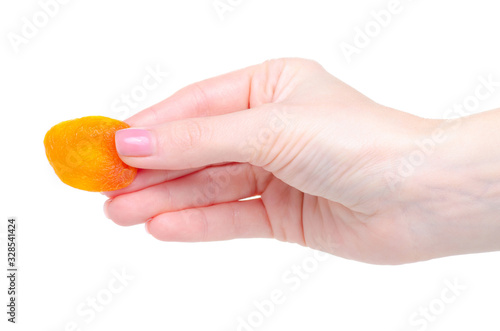 Dried apricots healthy sweet food in hand on white background isolation