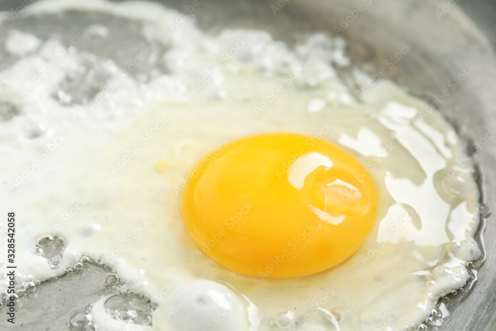 Delicious fried egg on pan, close up Delicious fried egg on pan, close up