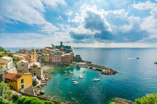 coastline and cityscape of colorful Vernazza village in Cinque Terre, Italy.