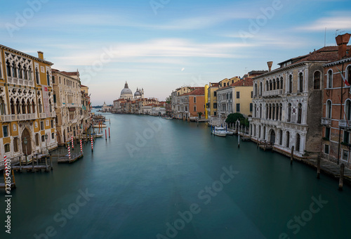 Famous view of Basilica di Santa Maria della Salute and grand canal from Accademia Bridge, Venice, Italy.