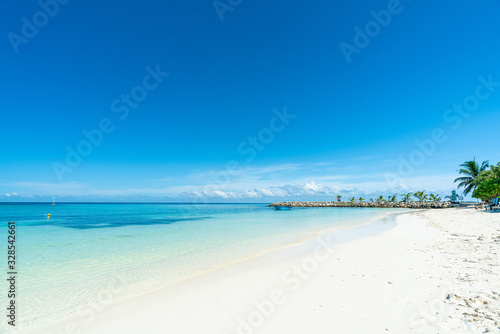Beautiful tropical beach and blue sky in Maafushi Island, Maldives photo