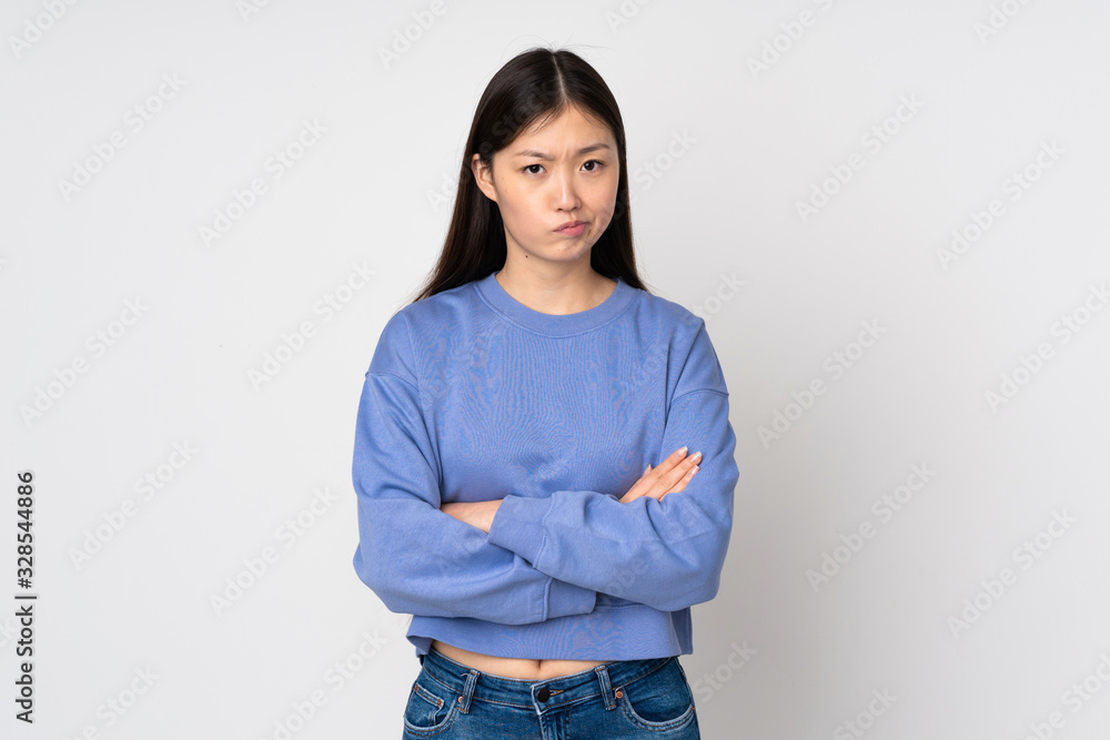 Young asian woman isolated on background feeling upset Young asian woman isolated on background feeling upset