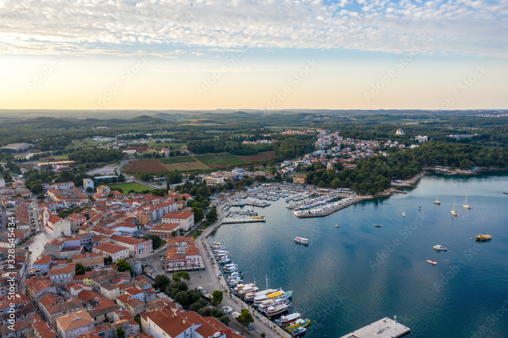 Sunrise over the ancient city of Porec in Croatia. Shooting from a drone.