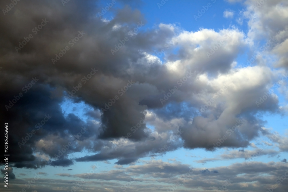 Fototapeta premium dramatic dark clouds over blue sky