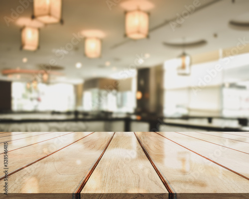 3D Rendering, Wooden top table with bokeh light effect and blur restaurant on background
