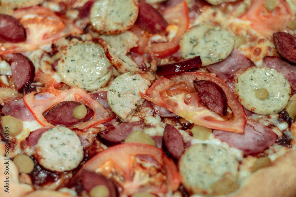 Fresh bavarian pizza close up. Delicious meat pizza ingredients