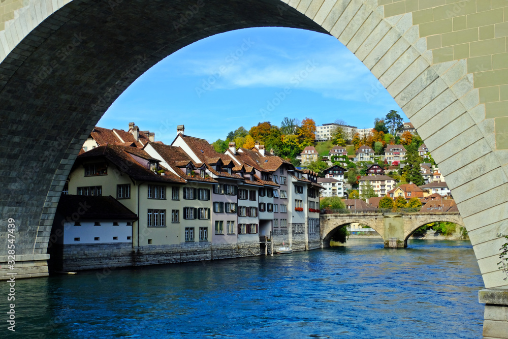 Bern, the capital city of Switzerland, old town shot under the Nydeggbrücke bridge with Aare river.  UNESCO World Heritage.