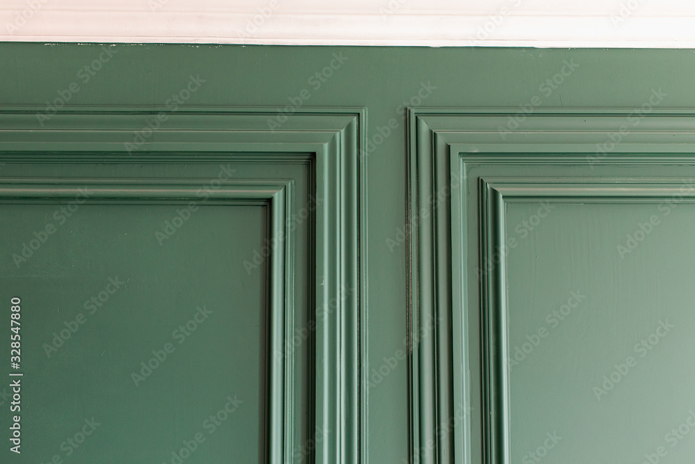 Redecoration of apartment, Finishing Works - Fragment Of Classic Green Walls With Installed Wall Panels, Decorated With Moldings. Сorner of the frame baguette Redecoration of apartment, Finishing Works - Fragment Of Classic Green Walls With Installed Wall Panels, Decorated With Moldings. Сorner of the frame baguette