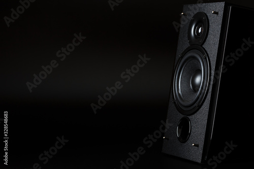 Audio speaker system on a black background. Minimalistic concept