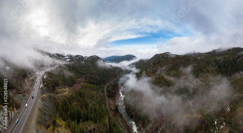 Aerial Panoramic drone view of Sea to Sky Highway during a cloudy winter morning. Taken between Squamish and Whistler  North of Vancouver  British Columbia  Canada. Panorama