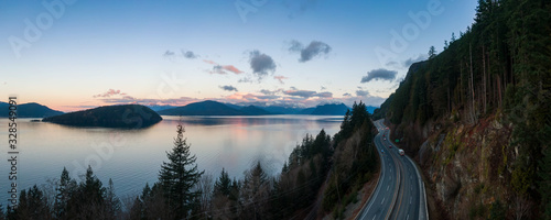 Sea to Sky Hwy in Howe Sound near Horseshoe Bay  West Vancouver  British Columbia  Canada. Aerial panoramic view during a colorful sunrise in Winter Season. Panorama