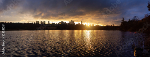 Burnaby, Greater Vancouver, British Columbia, Canada. Beautiful Panoramic View of Deer Lake during a colorful and vibrant winter sunset with Metrotown Buildings in the Background. Panorama photo