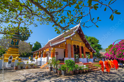 Wat Saen suk ka ram,buddish religion temple at Luang prabang Laos  in day time with monks. photo