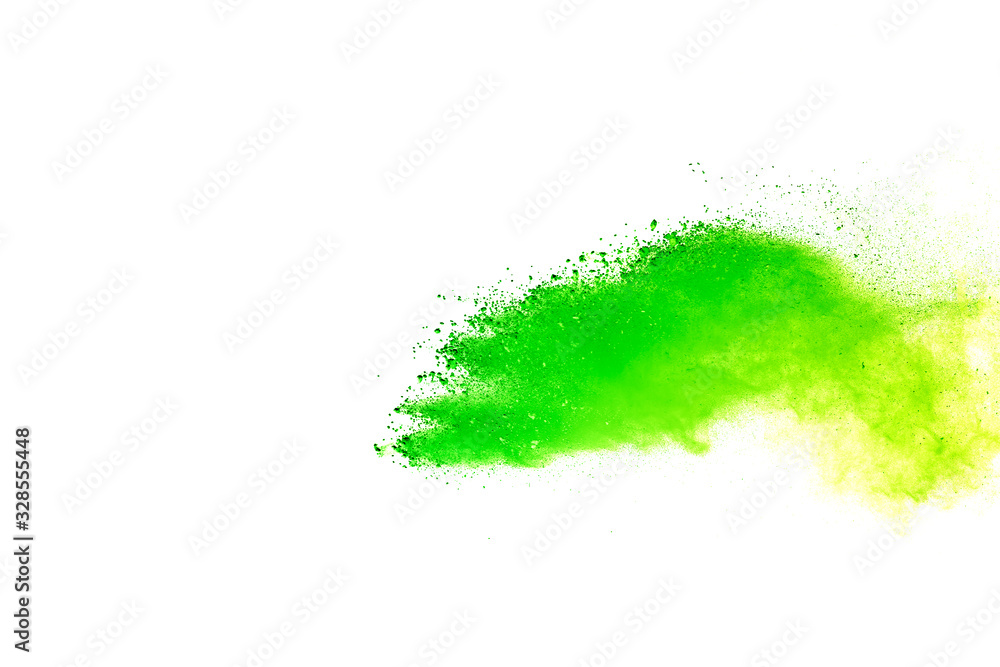 Fototapeta premium Wybuch zielonego i żółtego proszku na białym tle.