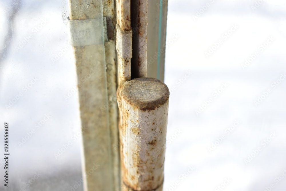 Old rusty locks and hinges on the window Old rusty locks and hinges on the window