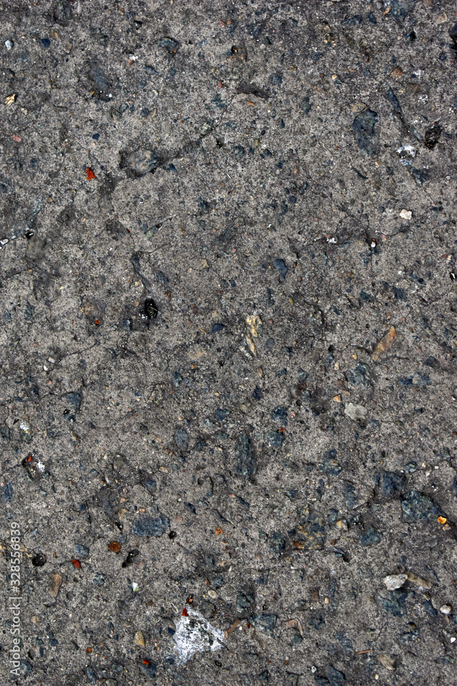 Grey old surface of asphalt and concrete wall Grey old surface of asphalt and concrete wall