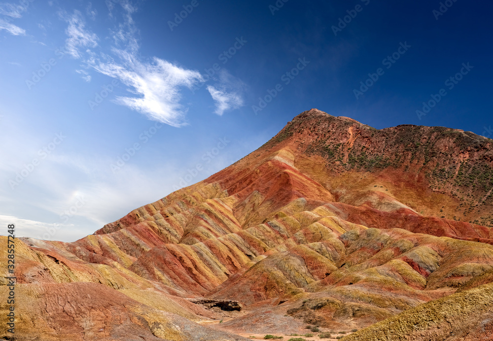 Rainbow mountains with blue sky in China at Zhangye Danxia geological park. Colorful rock formations with geological layers in the Gobi desert. Rainbow mountains with blue sky in China at Zhangye Danxia geological park. Colorful rock formations with geological layers in the Gobi desert.