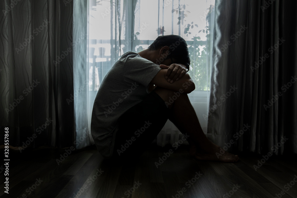 Sad people sitting on the bed in the bedroom, People with depression concept. Sad people sitting on the bed in the bedroom, People with depression concept.